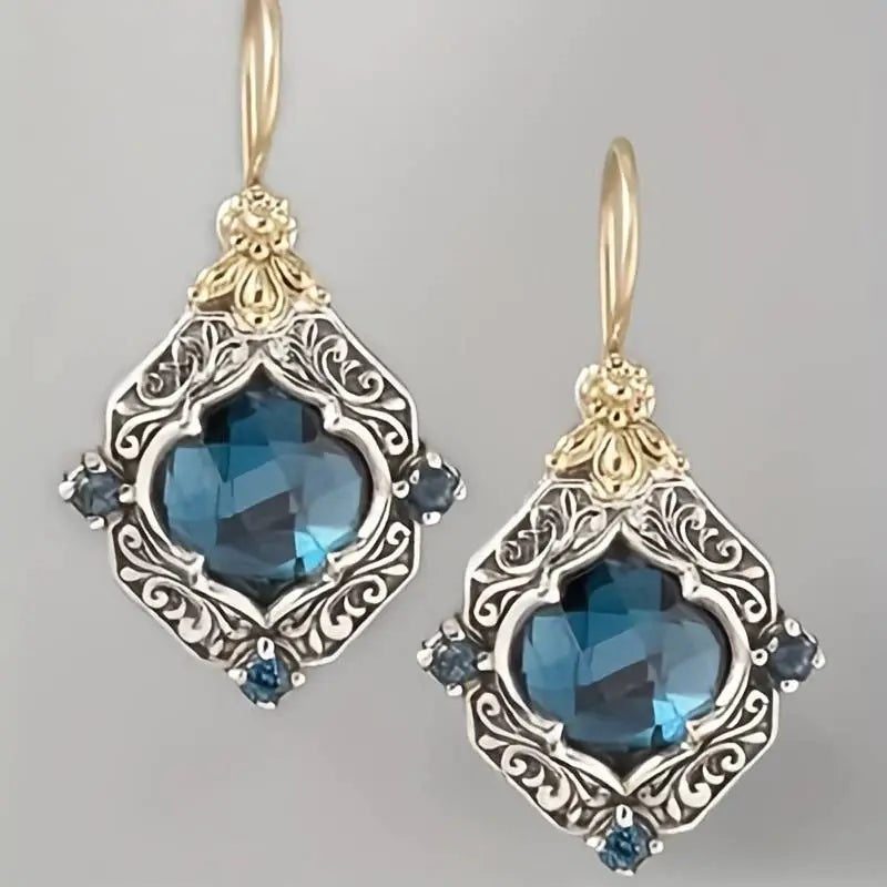 Boucles d'oreilles en cristal bleu en or et argent